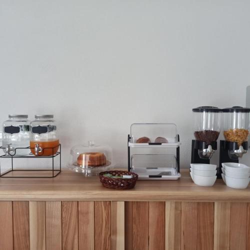 a wooden counter with various food items on it at Le Muse in Falerna Marina
