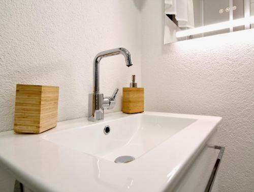 a white sink with a faucet in a bathroom at Ferienhaus Hadernigg in Hadernigg