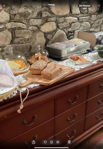 a buffet with bread and pastries on a table at Fennor Park Lodge in Oldcastle