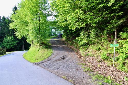 a road with a car parked on the side at Ferienhaus Hadernigg in Hadernigg
