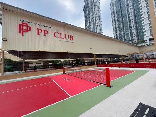 a tennis court in front of a building at 3 Towers Jalan Ampang By Serenity Vacation Homes in Kuala Lumpur