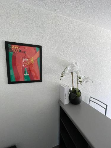a room with a desk with a picture on the wall at Toulouse Coconing & Peaceful Apartment in Toulouse