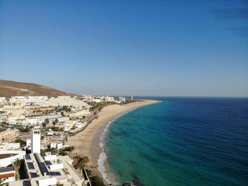 an aerial view of a beach and the ocean at Jandia Marina Loft in Morro del Jable