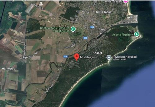 a map with a red circle in the middle at Villa Åhus By The Beach in Åhus