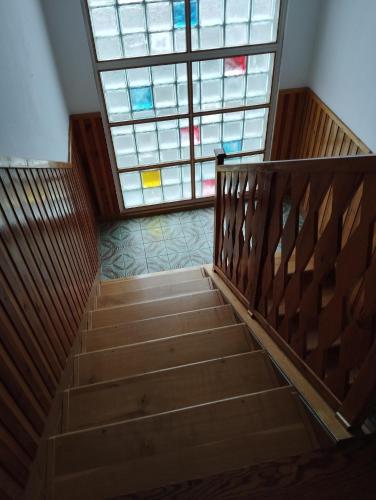 a staircase with a large window in a building at Vila Sobědraž in Kostelec nad Vltavou