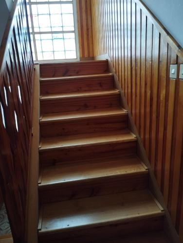 a staircase in a house with a window at Vila Sobědraž in Kostelec nad Vltavou