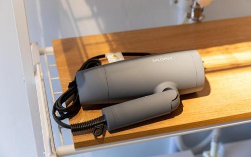 a router is sitting on a wooden shelf at SAMURAI Base in Hakone