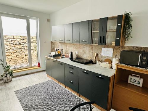 Nhà bếp/bếp nhỏ tại Pokoje przy Bulwarach