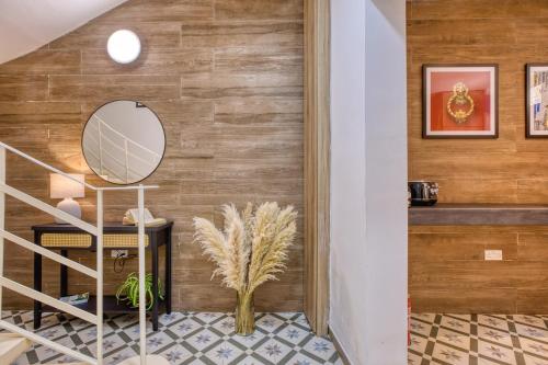 a hallway with a mirror and a staircase at Studio apartment 4 with kitchenette at the New Casa Vittoria by SF HOMES in Cospicua