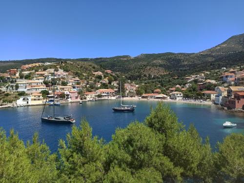 a group of boats in a body of water at Dionos Villa with Jacuzzi in Asos