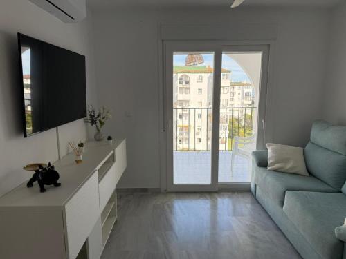 Un televizor și/sau centru de divertisment la Appartement Torrox Costa, Laguna Beach