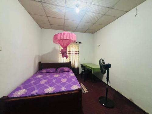 Katil atau katil-katil dalam bilik di Roobis Guest House