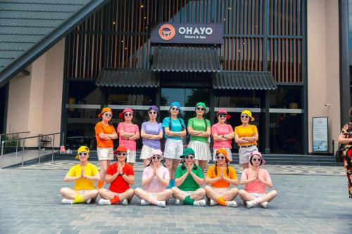 a group of women posing for a picture in front of a building at Lynn Times Thanh Thuỷ hotspring-KS 35 tầng- My Home in Phú Thọ