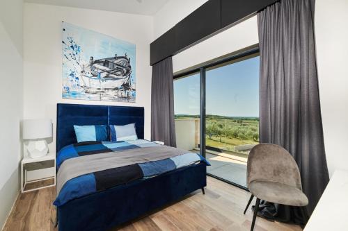 a bedroom with a bed and a large window at Villa Zora in Markovac