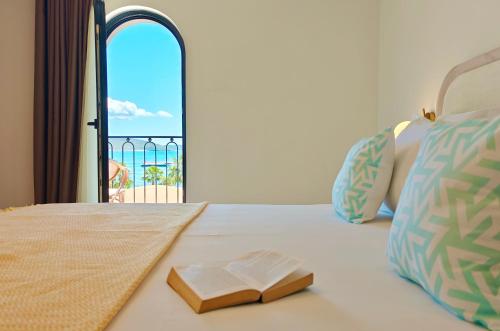 Postel nebo postele na pokoji v ubytování VILLA MARGARIT Boutique Hotel