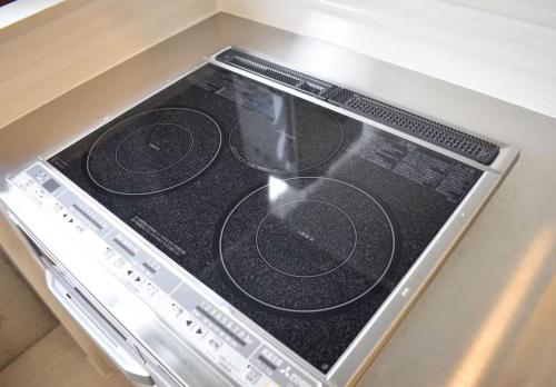 a stove top oven with a pot on it at HOTEL Viviana in Naha