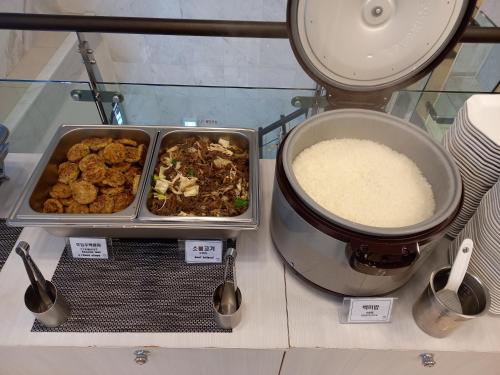 a table with a bowl of food and a bowl of rice at Toyoko Inn Busan Station No.1 in Busan