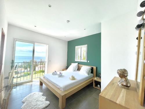 Postel nebo postele na pokoji v ubytování Villa Selfoss vue mer 300m de la plage