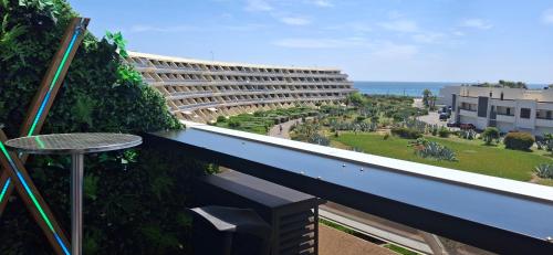 a view of a building from a balcony at Village Naturiste Cap d'Agde le Luxury of Love Vue mer in Cap d'Agde