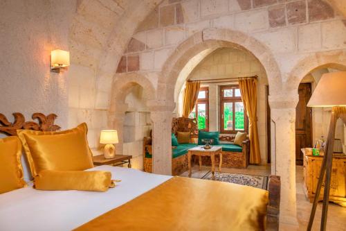 a bedroom with a king sized bed in a room at Onur Cave Cappadocia in Goreme