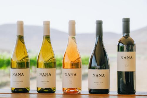 four bottles of wine sitting on a table at הפטריוטית-יקב ננה in Mitzpe Ramon