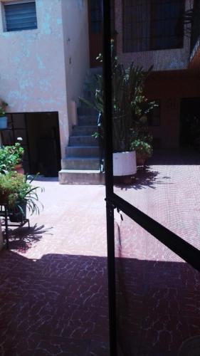 a fence in front of a building with stairs at El Paraíso Escondido in Guanajuato