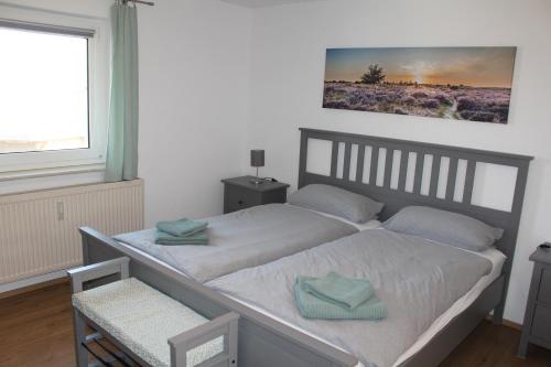 Ένα ή περισσότερα κρεβάτια σε δωμάτιο στο Ferienwohnung Feldblick