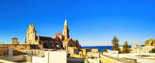 a view of a city with a church at Ademè dimora di charme in Monopoli