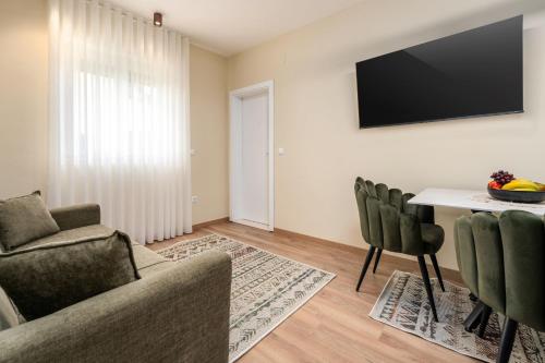 TV a/nebo společenská místnost v ubytování Olea di Orsera