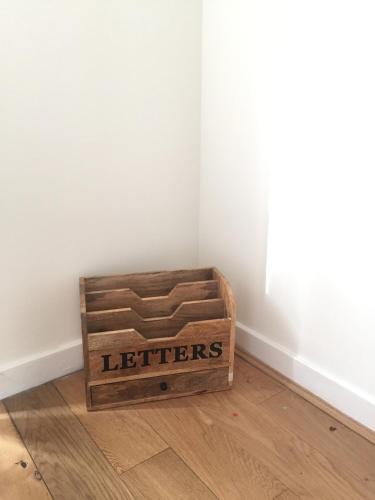 a wooden crate sitting on the floor of a room at NEW 2BD Flat Heart of Battersea - Close to Station in London