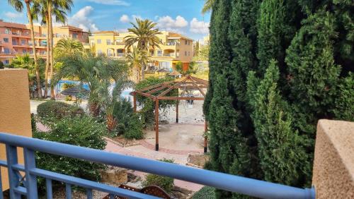 a view of a garden from a balcony of a resort at CSS Cheerful Smart Superior 2BD Townhouse Limnaria Gardens in Paphos City