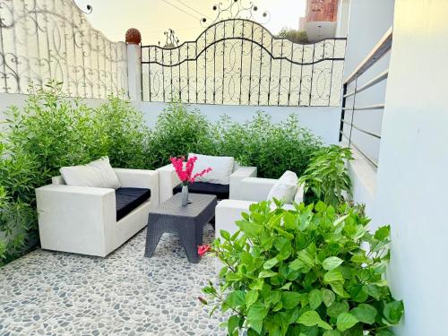 a patio with a white couch and a table at White Gorf Hotel in Luxor