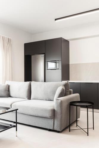 a living room with a couch and a table at Loka Residence in Kavala