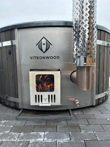 a large metal oven with a fire in it at Romantische Wellness-Oase in Haasow