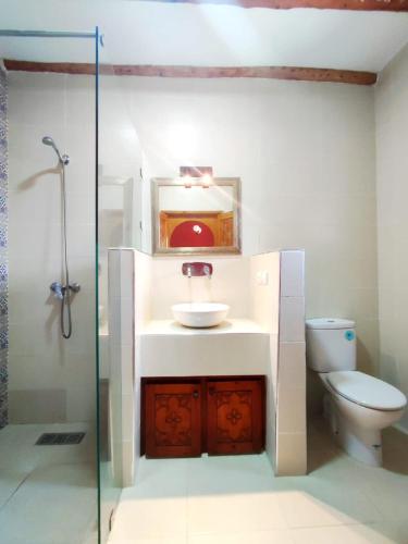 a bathroom with a sink and a toilet at Villa Riad Ahlam in Sidi Kaouki