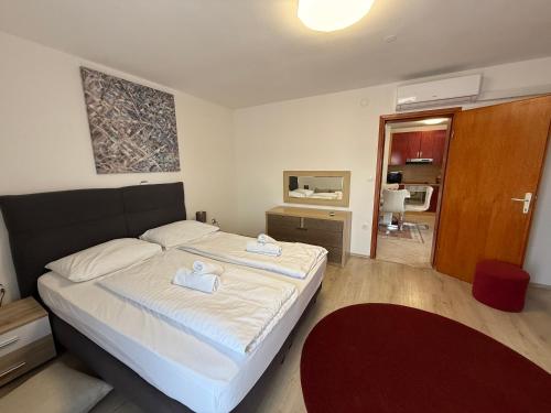 Posteľ alebo postele v izbe v ubytovaní Apartments Puntamika