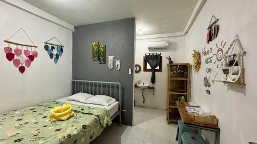 Postel nebo postele na pokoji v ubytování D'Flora Homestay