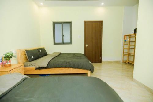 Postel nebo postele na pokoji v ubytování Sơn Dalat house