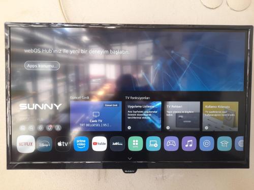 a tablet screen on a wall with many different apps at Class Hotel in Kırklareli