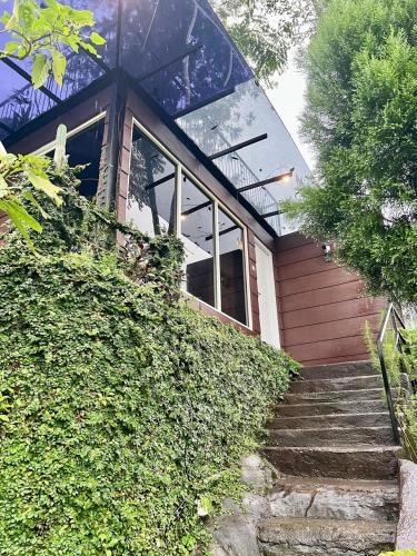 a house with stairs leading up to it at de Pipo Bromo in Sukapura