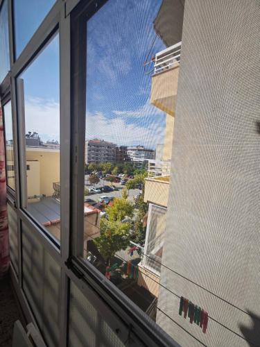 a view of a city from a window on a building at Cozy apartment in the city center in Katerini