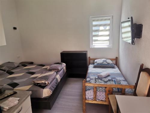 Postel nebo postele na pokoji v ubytování Ilce apartments