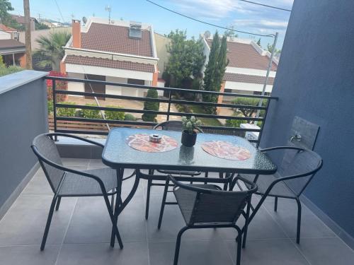 a blue table and chairs on a balcony at Aelia Blu 2 Maisonette in Ofrínion
