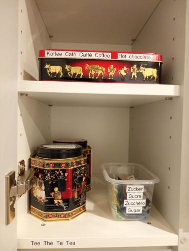a shelf with some toys and a container on it at 3,5 Zimmer Parterre Wohnung in Alpnach