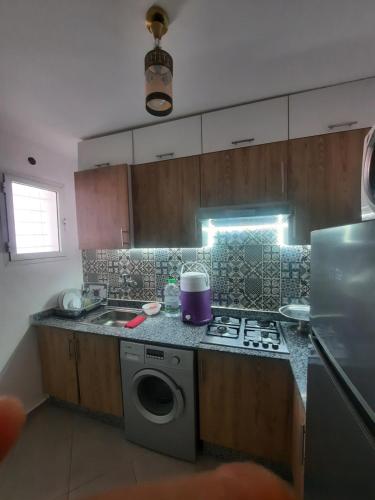 Una cocina o cocineta en Le paradis du surf