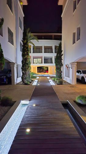 an empty courtyard of a building at night at CSS Coastal Smart Superior With Gym Spacious Apt in Paphos City