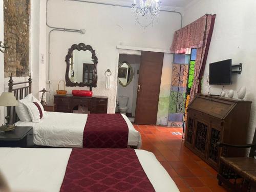 Кровать или кровати в номере Hotel Casa de la Luz