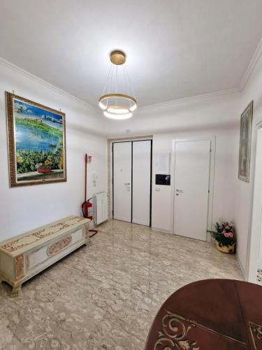 a large living room with a painting on the wall at Casa Vacanze Fiore Ciampino Airport - Rome Station - 108 mqs in Ciampino
