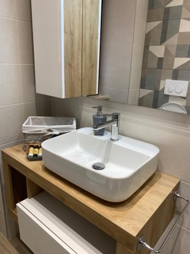 a bathroom with a white sink and a mirror at IL BALCONCINO di GR in Fondi