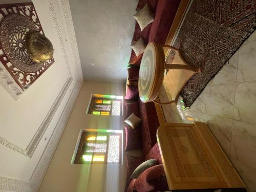 an overhead view of a staircase with stained glass windows at Maison Moussaoui in Meknès